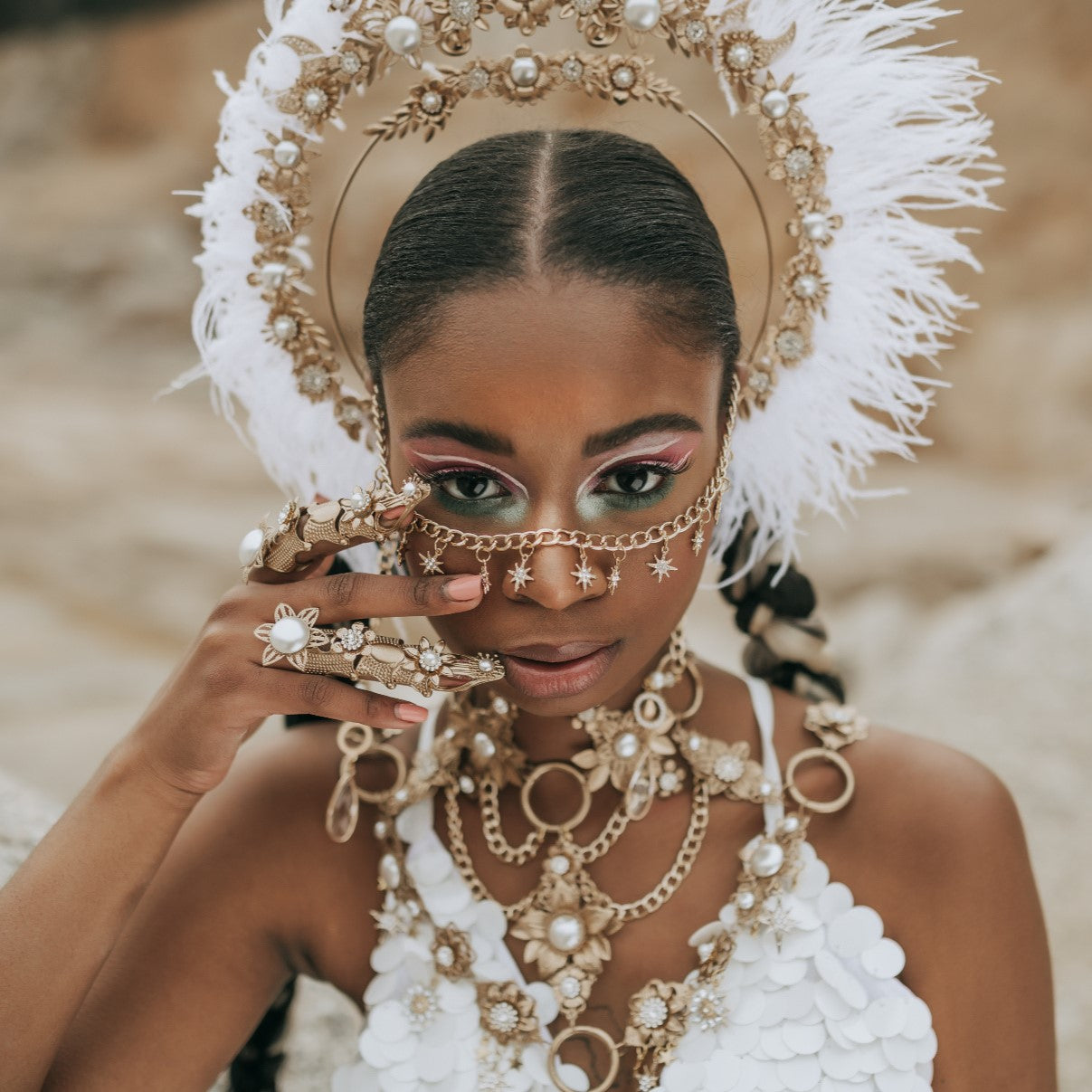 Boho festival bride wearing a celestial pearl halo crown and handcrafted statement jewelry by Carbickova Crowns.
